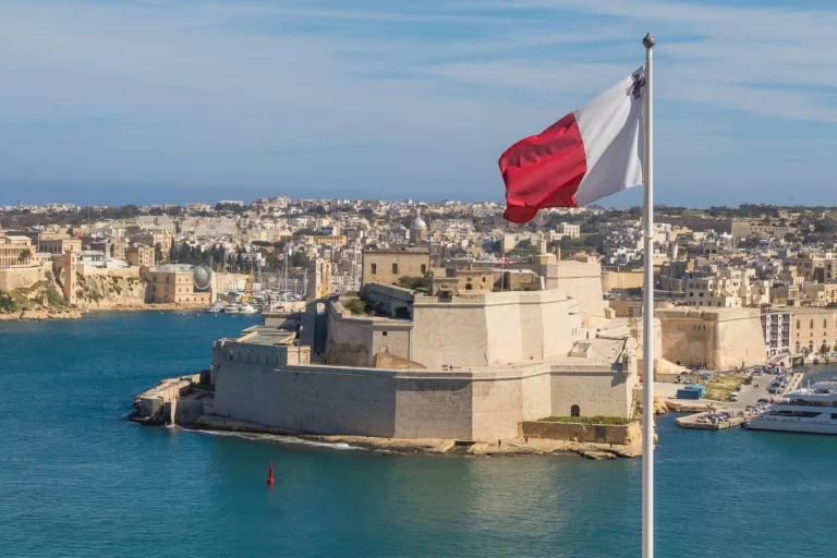 The flag of Malta over the port of Valletta, the country's capital.
