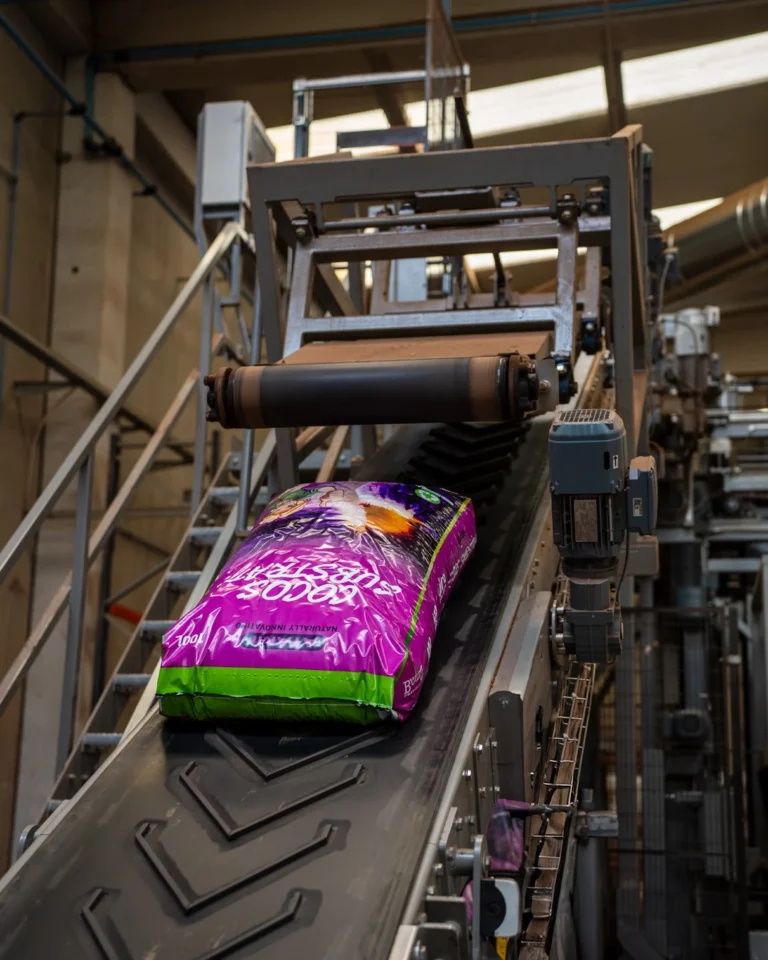 A bag of Cocos Substrate during production, ready for packaging.